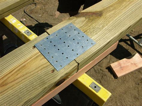 joining boards with a metal brackets|joining two wooden boards together.